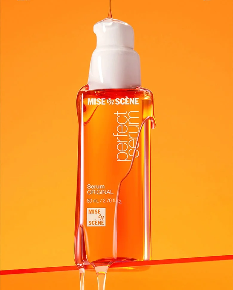 Ảnh bìa Facebook giới thiệu chai serum tóc Mise en Scène Perfect Serum nổi bật trên nền cam rực rỡ
